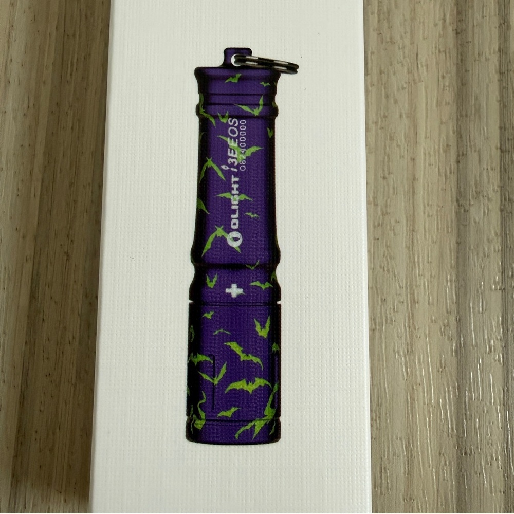 Olight i3E EOS Mono-Output Key Chain LED Flashlight Purple w Green Bat Design - Picture 2 of 4